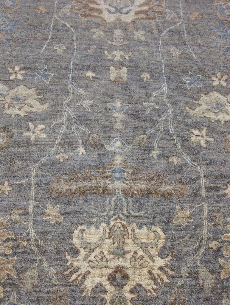 Hand knotted one of a kind 8x10 modern grey turkish oushak wool rug from Pakistan with beige, brown, green tint, ivory and blue accent colors.