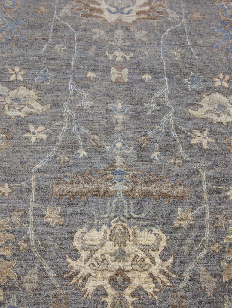 Hand knotted one of a kind 8x10 modern grey turkish oushak wool rug from Pakistan with beige, brown, green tint, ivory and blue accent colors.