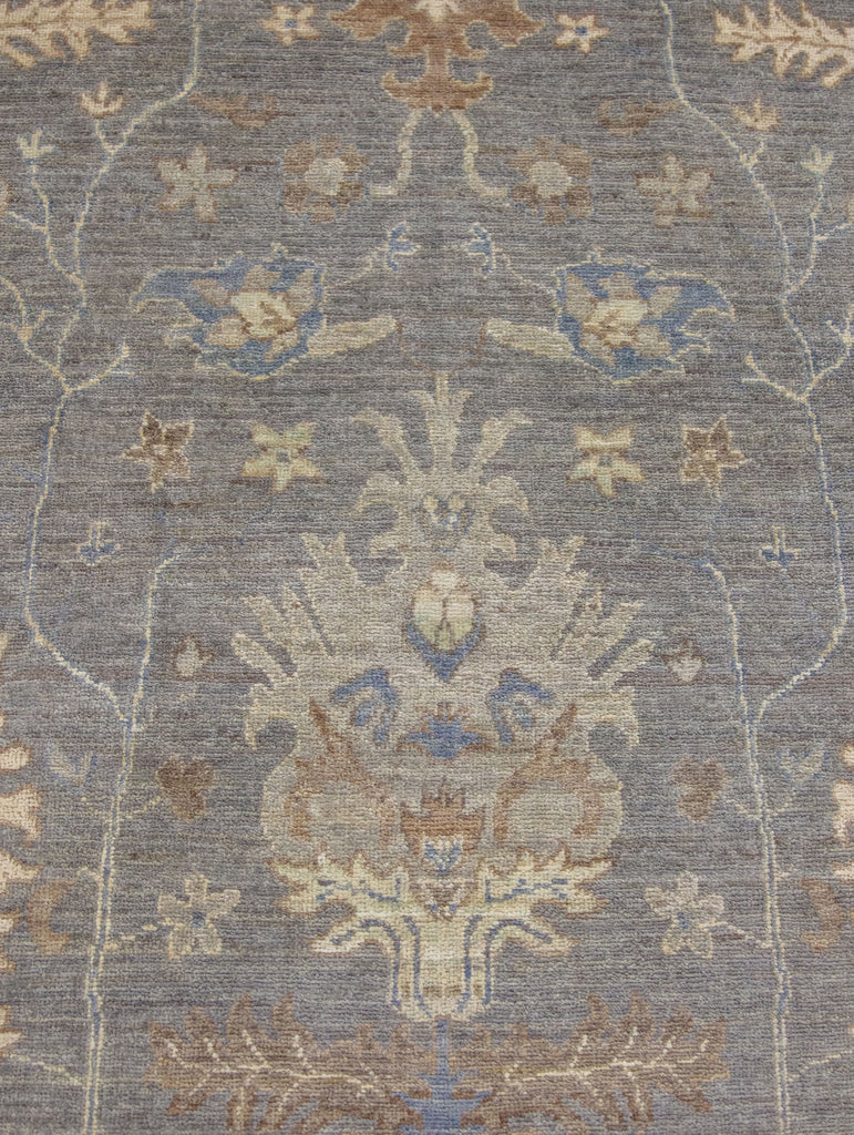 Hand knotted one of a kind 8x10 modern grey turkish oushak wool rug from Pakistan with beige, brown, green tint, ivory and blue accent colors.