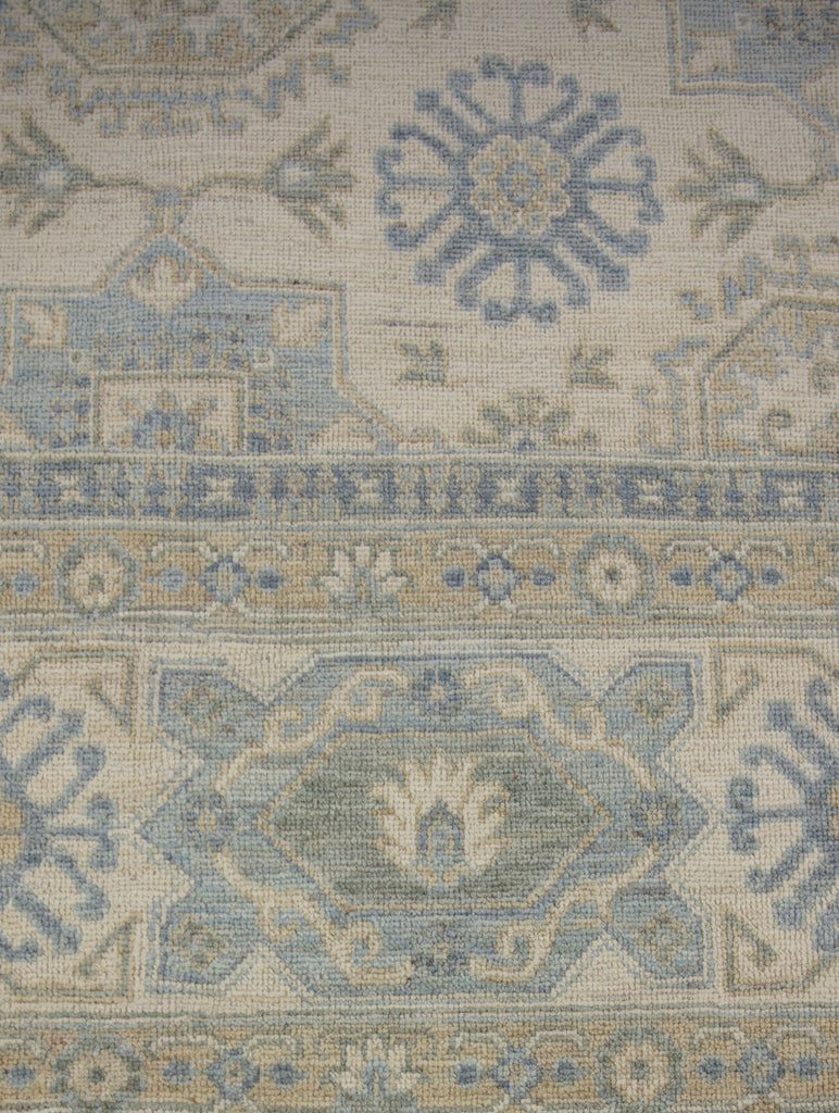 10x14 low pile hand knotted wool turkish oushak area rug with ivory yellow and light blue.