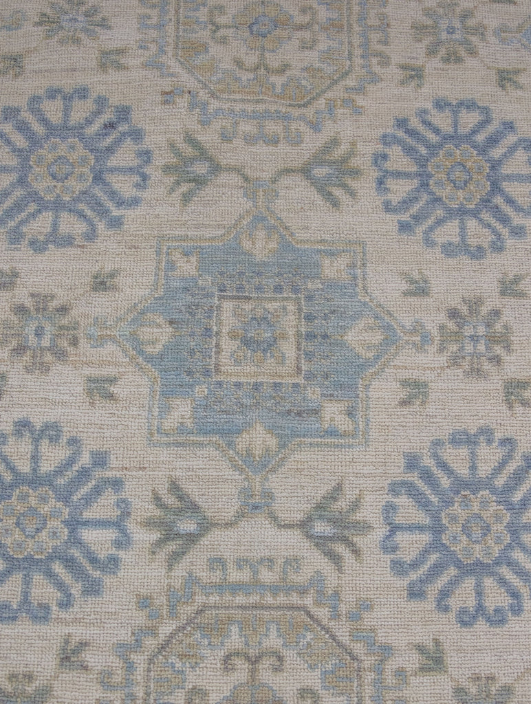 10x14 low pile hand knotted wool turkish oushak area rug with ivory yellow and light blue.