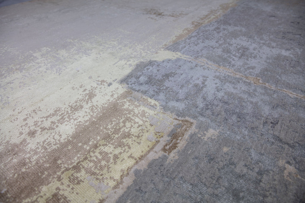 8x10 hand knotted modern contemporary glam rug made with wool and bamboo silk pile and cream, grey, brown, beige and slate colored rug.