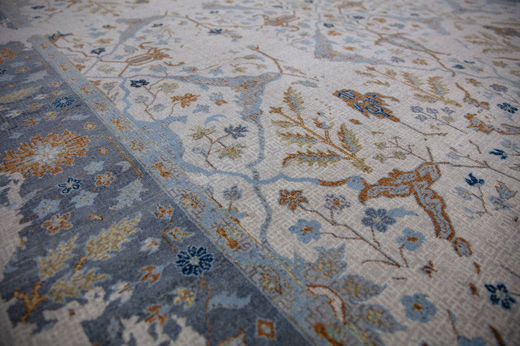 Roya Rugs Elke EL-03 hand knotted modern distressed oriental turkish oushak design wool area rug with ivory, grey, burnt orange, brown, dirty gold, teal, light blue and dark blue. Available sizes 4x6, 8x10, 9x12, 10x14, 12x15 and large oversized 12x18.
