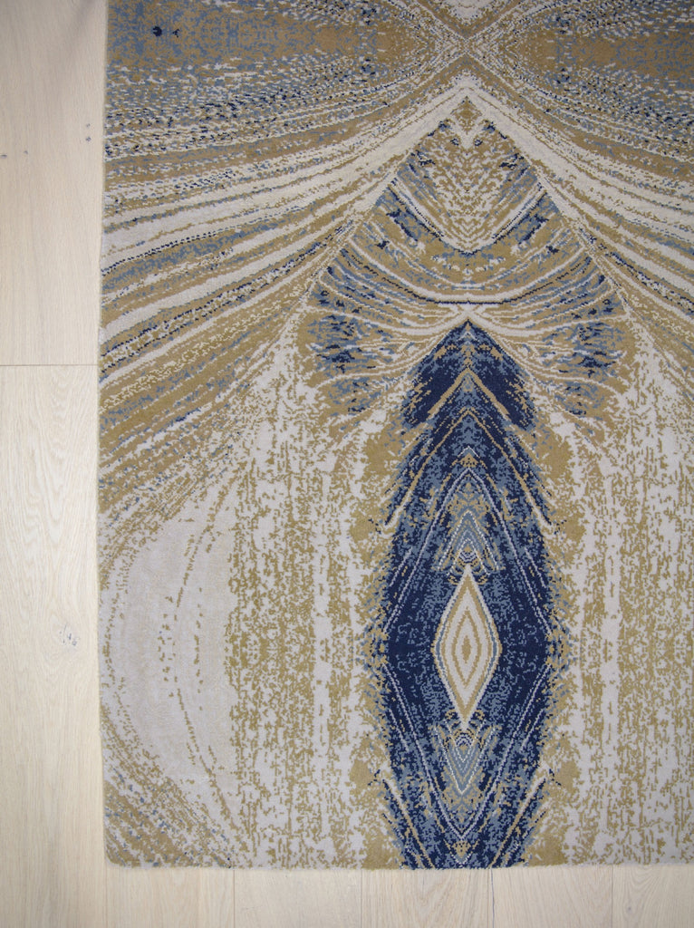 8x10 modern peacock kaleidoscope design hand knotted wool and silk rug with navy blue, light blue, pearl grey and dirty gold. 196 knots per square inch fine rug.