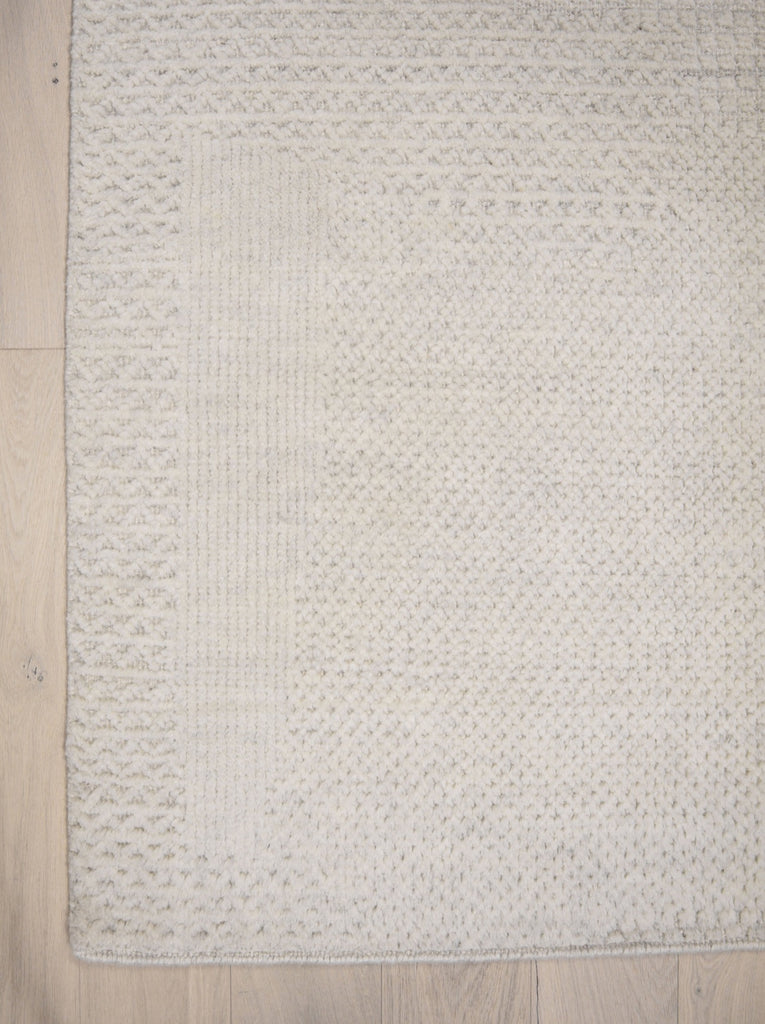 Roya Rugs Fola FO-01 handmade neutral textured ivory wool rug with high low and geometric modern design. Available in oversized 12x15 and standard 5x8, 6x9, 8x10, 9x12, 10x14 rug size.