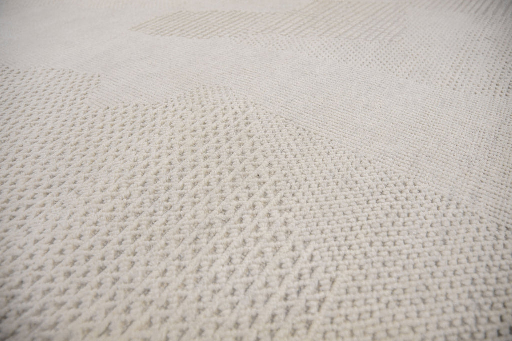 Roya Rugs Fola FO-01 handmade neutral textured ivory wool rug with high low and geometric modern design. Available in oversized 12x15 and standard 5x8, 6x9, 8x10, 9x12, 10x14 rug size.