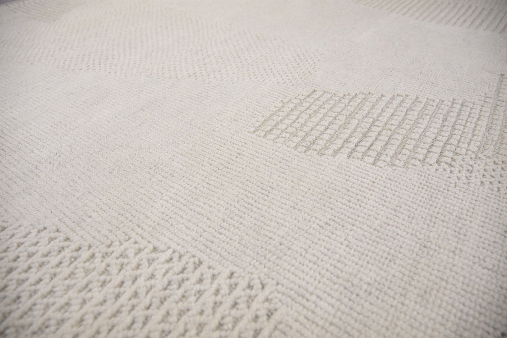 Roya Rugs Fola FO-01 handmade neutral textured ivory wool rug with high low and geometric modern design. Available in oversized 12x15 and standard 5x8, 6x9, 8x10, 9x12, 10x14 rug size.