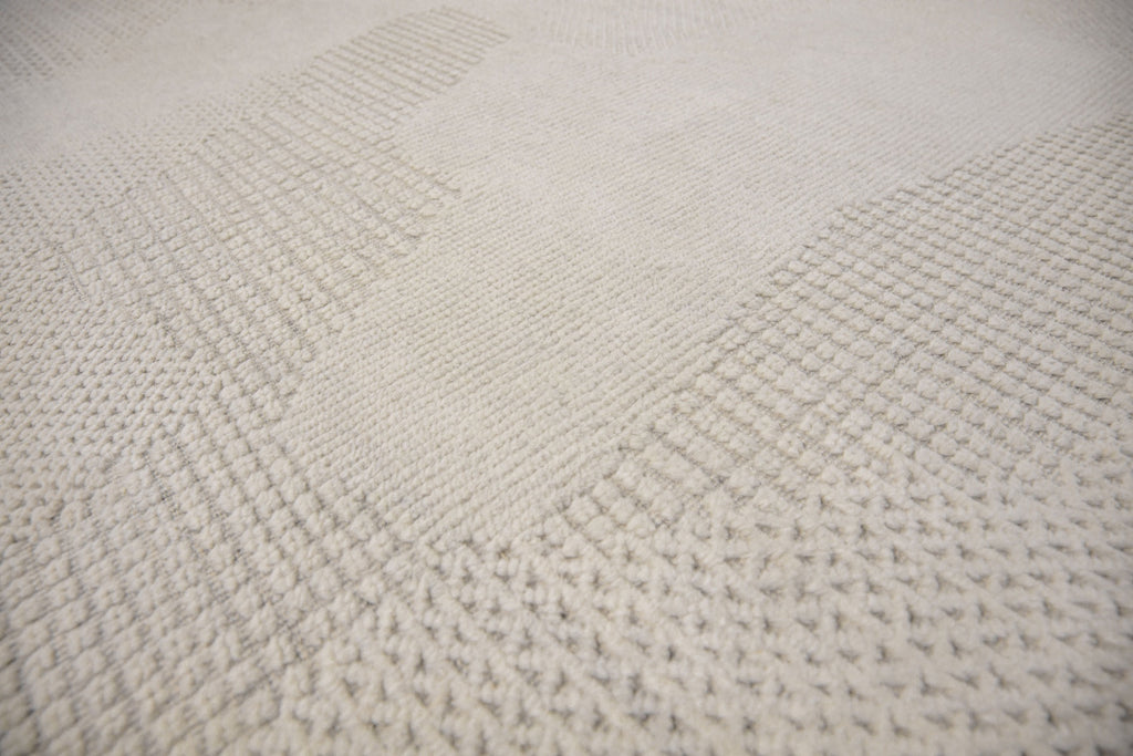 Roya Rugs Fola FO-01 handmade neutral textured ivory wool rug with high low and geometric modern design. Available in oversized 12x15 and standard 5x8, 6x9, 8x10, 9x12, 10x14 rug size.