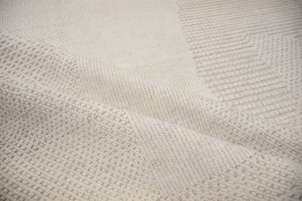 Roya Rugs Fola FO-01 handmade neutral textured ivory wool rug with high low and geometric modern design. Available in oversized 12x15 and standard 5x8, 6x9, 8x10, 9x12, 10x14 rug size.