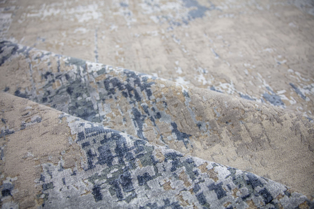 Modern 8x10 navy blue area rug made of wool and bamboo silk and accent light blue, beige, grey and taupe colors.