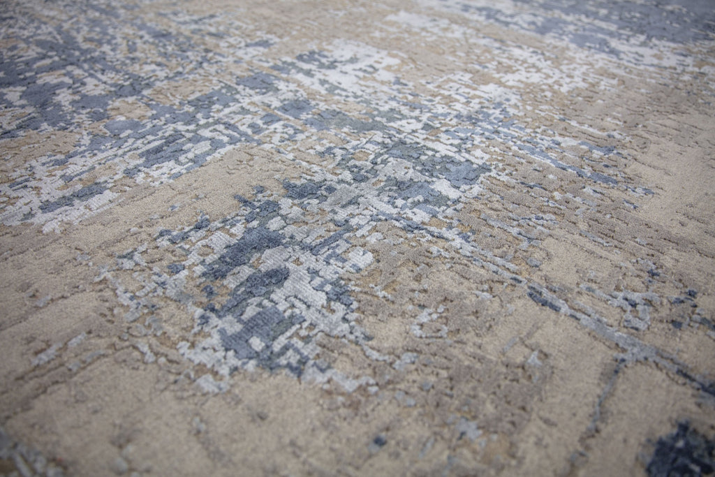Modern 8x10 navy blue area rug made of wool and bamboo silk and accent light blue, beige, grey and taupe colors.