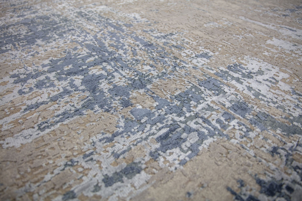 Modern 8x10 navy blue area rug made of wool and bamboo silk and accent light blue, beige, grey and taupe colors.
