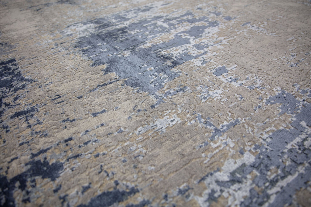Modern 8x10 navy blue area rug made of wool and bamboo silk and accent light blue, beige, grey and taupe colors.