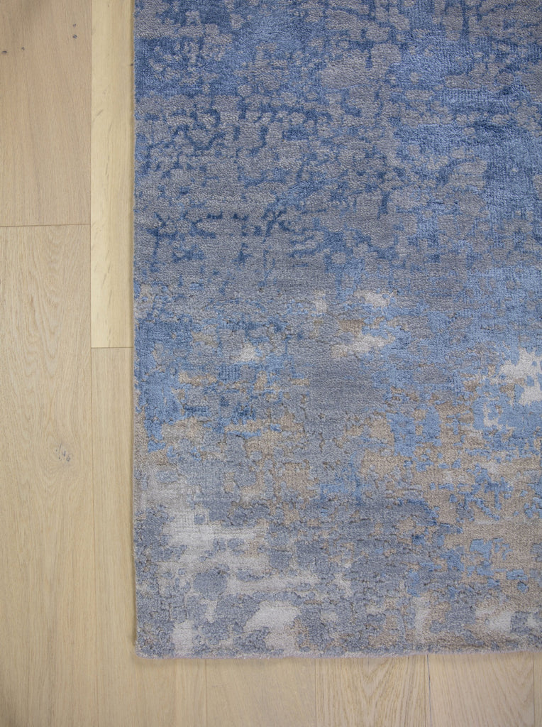 Modern abstract blue and brown 8x10 area rug hand-knotted of wool and bamboo silk with asymmetrical rug design. 