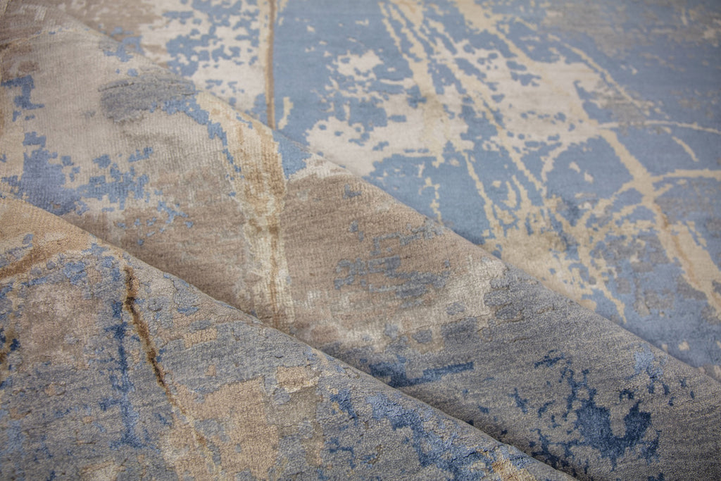 Modern abstract blue and brown 8x10 area rug hand-knotted of wool and bamboo silk with asymmetrical rug design. 