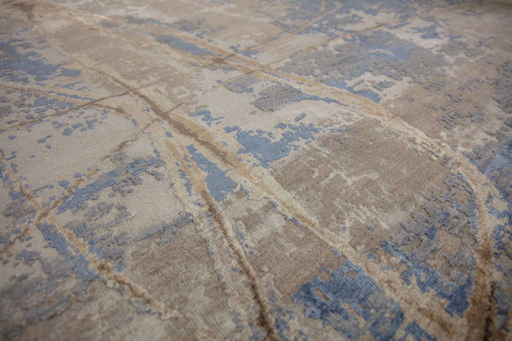 Modern abstract blue and brown 8x10 area rug hand-knotted of wool and bamboo silk with asymmetrical rug design. 