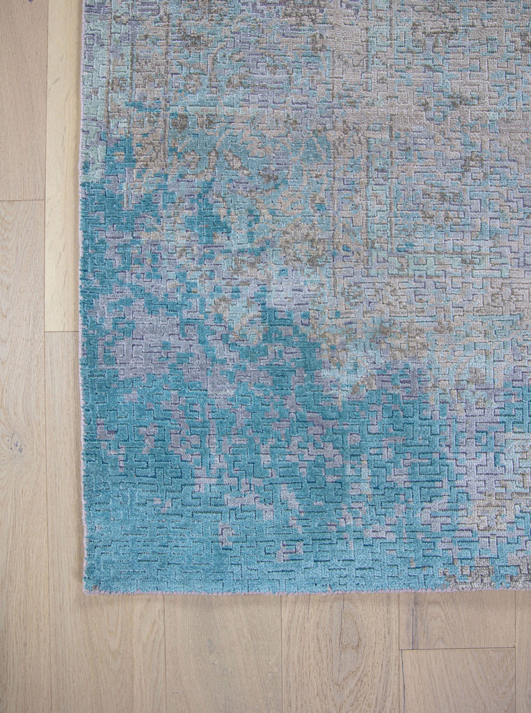 Aqua blue and sea foam green  8x10 hand knotted wool and pure silk pile area rug with a center medallion.