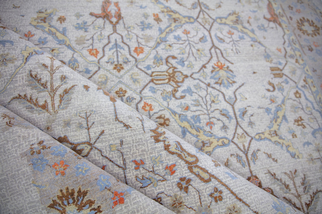 Roya Rugs Elke EL-02 colorful hand knotted modern distressed oriental turkish oushak wool rug with ivory, grey, orange, brown, beige/yellow, and light blue colors. Available in rug sizes 4x6, 8x10, 9x12, 10x14, 12x15 and large oversized 12x18.
