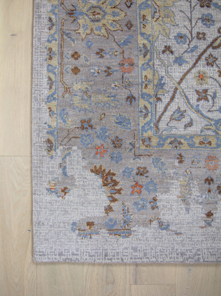 Roya Rugs Elke EL-02 colorful hand knotted modern distressed oriental turkish oushak wool rug with ivory, grey, orange, brown, beige/yellow, and light blue colors. Available in rug sizes 4x6, 8x10, 9x12, 10x14, 12x15 and large oversized 12x18.