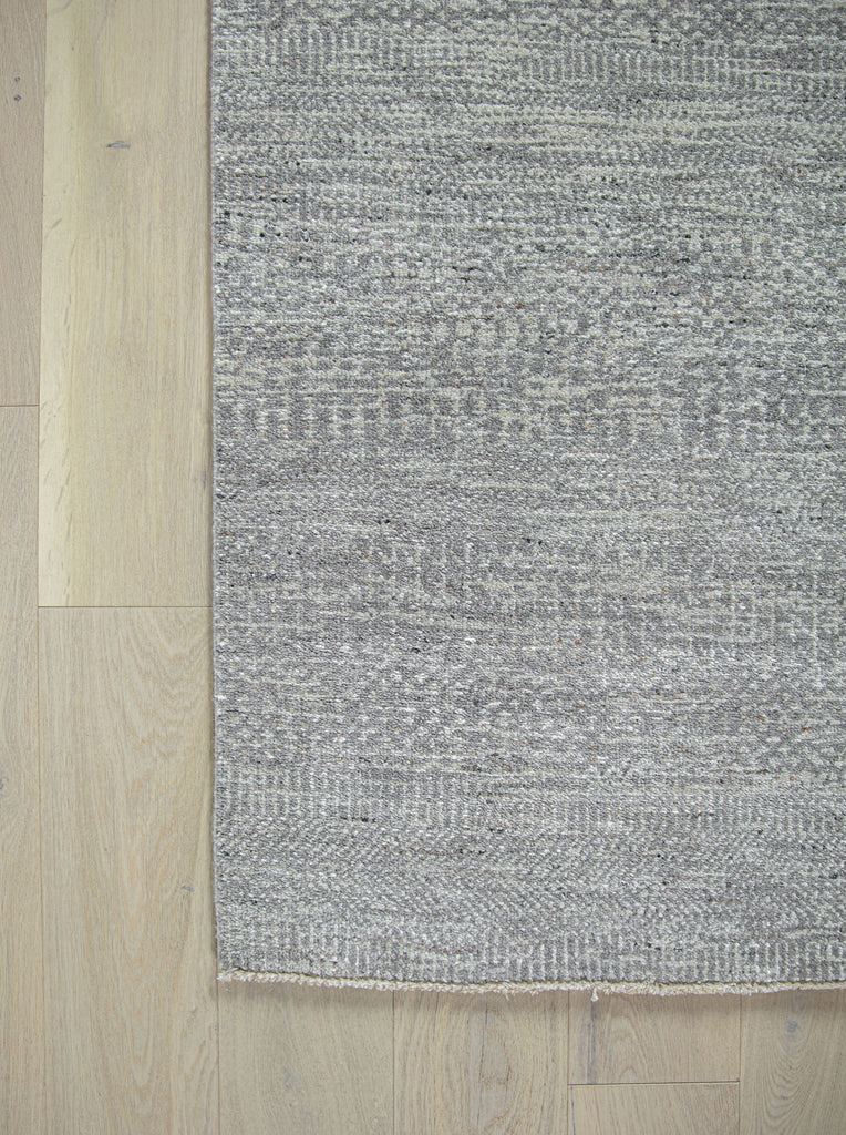 Handknotted handmade wool rug and viscose rug. solid transitional rug. sisal rug. grey, gray, neutral, ivory, white, charcoal, black rug. short fringe rug. durable long lasting performance rug. no shedding rug. easy to clean rug. rug size 2x3, 8x10, 9x12, 10x14, 12x15, 12x18, 2'6"x12' runner rug, 2'9"x12' runner rug, over sized runner, 16' long runner, 20' long runner rug. Made in india. luxury rug. Hickory, North Carolina rug showroom located in Hickory Furniture Mart rug accessories.