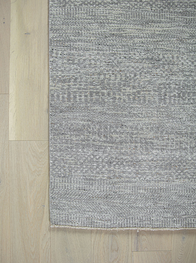 Handknotted handmade wool rug and viscose rug. solid transitional rug. sisal rug. grey, gray, neutral, ivory, white, charcoal, black rug. short fringe rug. durable long lasting performance rug. no shedding rug. easy to clean rug. rug size 2x3, 8x10, 9x12, 10x14, 12x15, 12x18, 2'6"x12' runner rug, 2'9"x12' runner rug, over sized runner, 16' long runner, 20' long runner rug. Made in india. luxury rug. Hickory, North Carolina rug showroom located in Hickory Furniture Mart rug accessories.