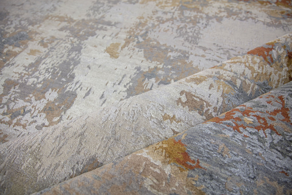 Essence ES-02 Grey/Ochre Hand Knotted handmade wool & silk rug. Luxury hand spun wool & silk rug that is durable and best for high traffic areas and rooms. Hand carved area rug. Performance and easy to clean rug. Colors include ochre, copper, penny, beige, brown, grey, gray, blue, slate blue, ivory, and white. Contemporary and abstract colorful handmade wool and silk rug. available in sizes 4x6, 8x10, 9x12, 10x14, 12x15, 12x18, oversized and custom. Available at Roya Rugs in Hickory, NC.