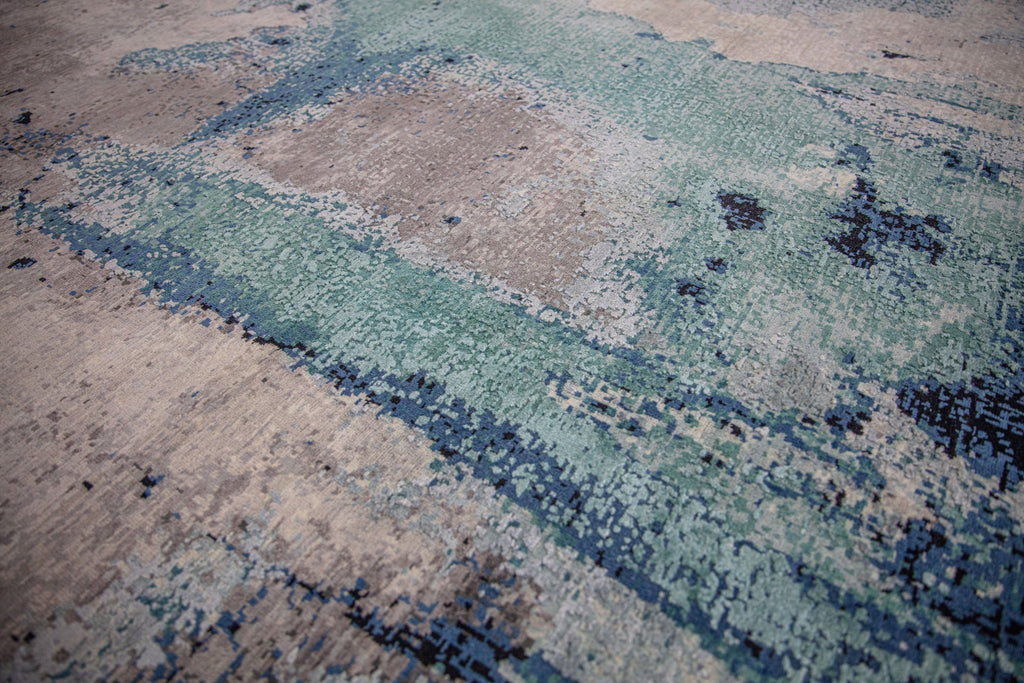 Inspired by the lagoons in the Southeast, the Biscayne collection lifts any contemporary room needing a pop of color. The show stopping, abstract patterns will bring life into any interior. Hand knotted in India of wool and silk, the Biscayne collection will stand the test of time with its exquisite craftsmanship. Handknotted teal, turquoise, grey, abstract, modern, contemporary rug.