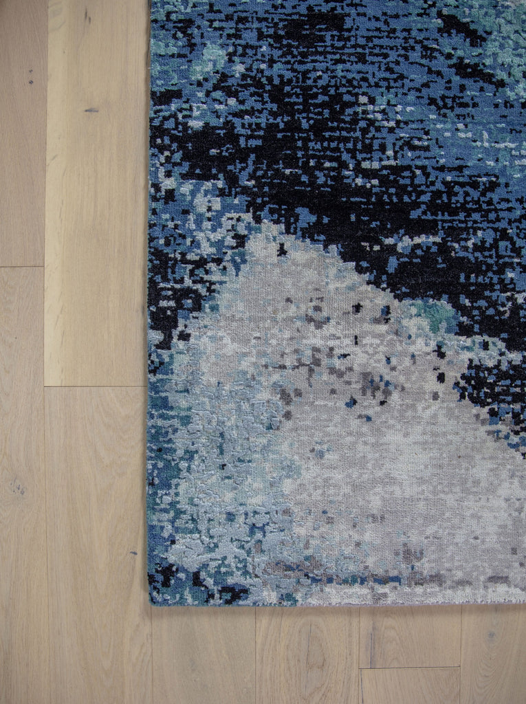 Inspired by the lagoons in the Southeast, the Biscayne collection lifts any contemporary room needing a pop of color. The show stopping, abstract patterns will bring life into any interior. Hand knotted in India of wool and silk, the Biscayne collection will stand the test of time with its exquisite craftsmanship. Handknotted teal, turquoise, grey, abstract, modern, contemporary rug.