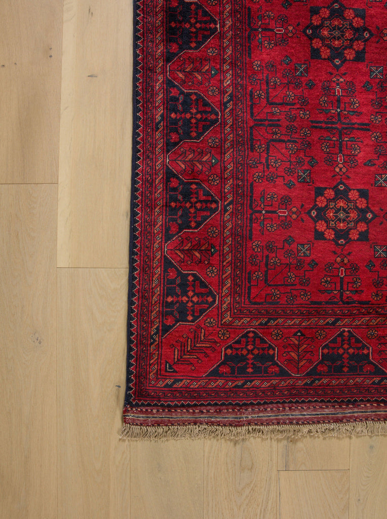 Roya Rugs 5x6 rug in dark maroon red and black oriental tribal wool rug with rich colors with high quality belgian wool and vegetable dye and dense pile dark rugs for foyer and office. Rug store Hickory NC hand knotted quality texture textura rugs togar North Carolina Asheville rugs and Denver NC. 