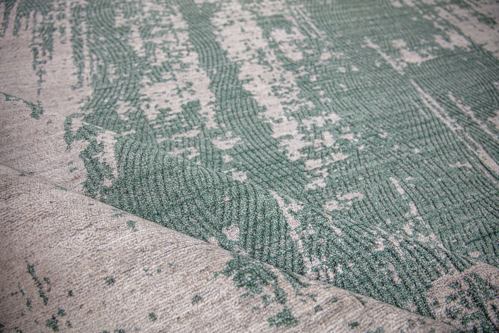 Abstract modern green 8x10 hand woven area rug with ivory/white texture and finger print design 8x10