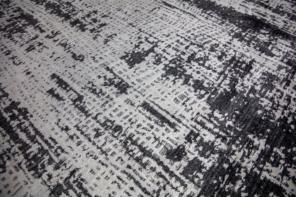 Hand woven cheap luxury black and white modern rug 8x10 with texture, shimmer and soft pile.