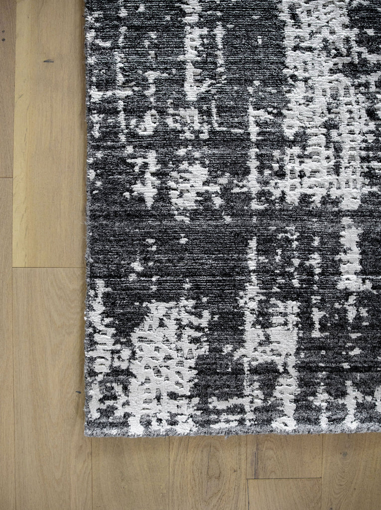 Hand woven cheap luxury black and white modern rug 8x10 with texture, shimmer and soft pile.