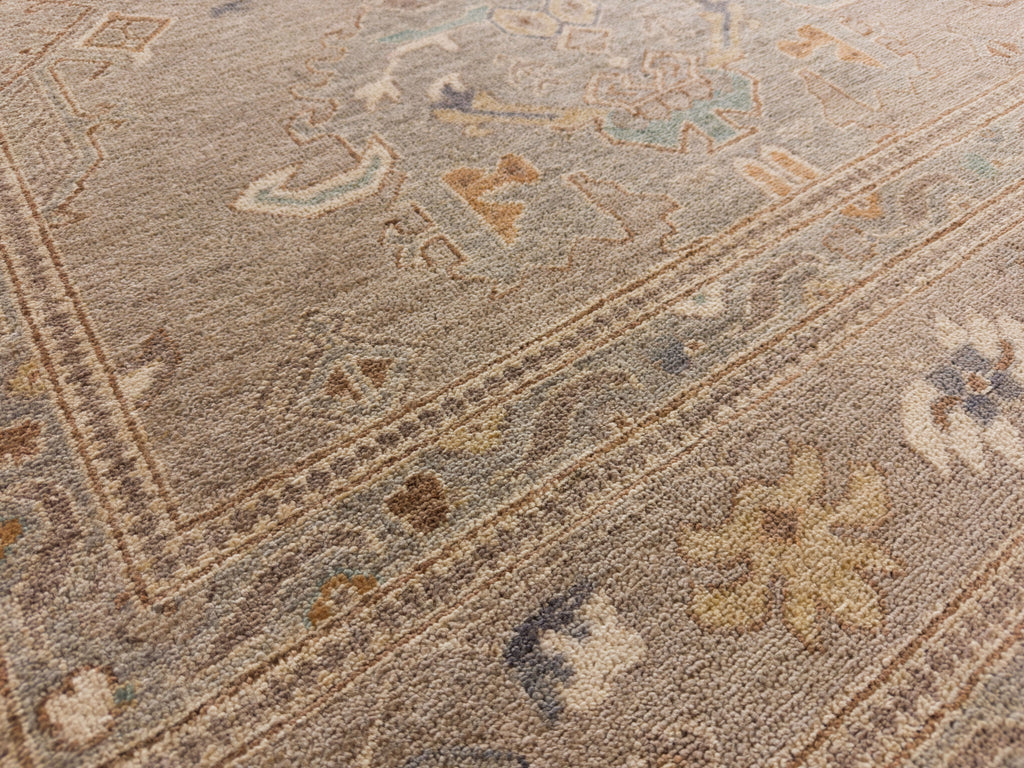 8x10 Roya Rugs Pineville North Carolina modern muted oushak wool rug with neutral greige, grey, beige, apricot orange, light aqua blue and brown colors with vintage design carpet.