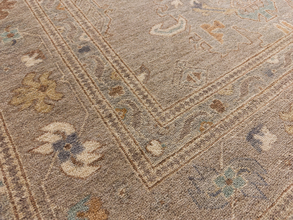 8x10 Roya Rugs Pineville North Carolina modern muted oushak wool rug with neutral greige, grey, beige, apricot orange, light aqua blue and brown colors with vintage design carpet.