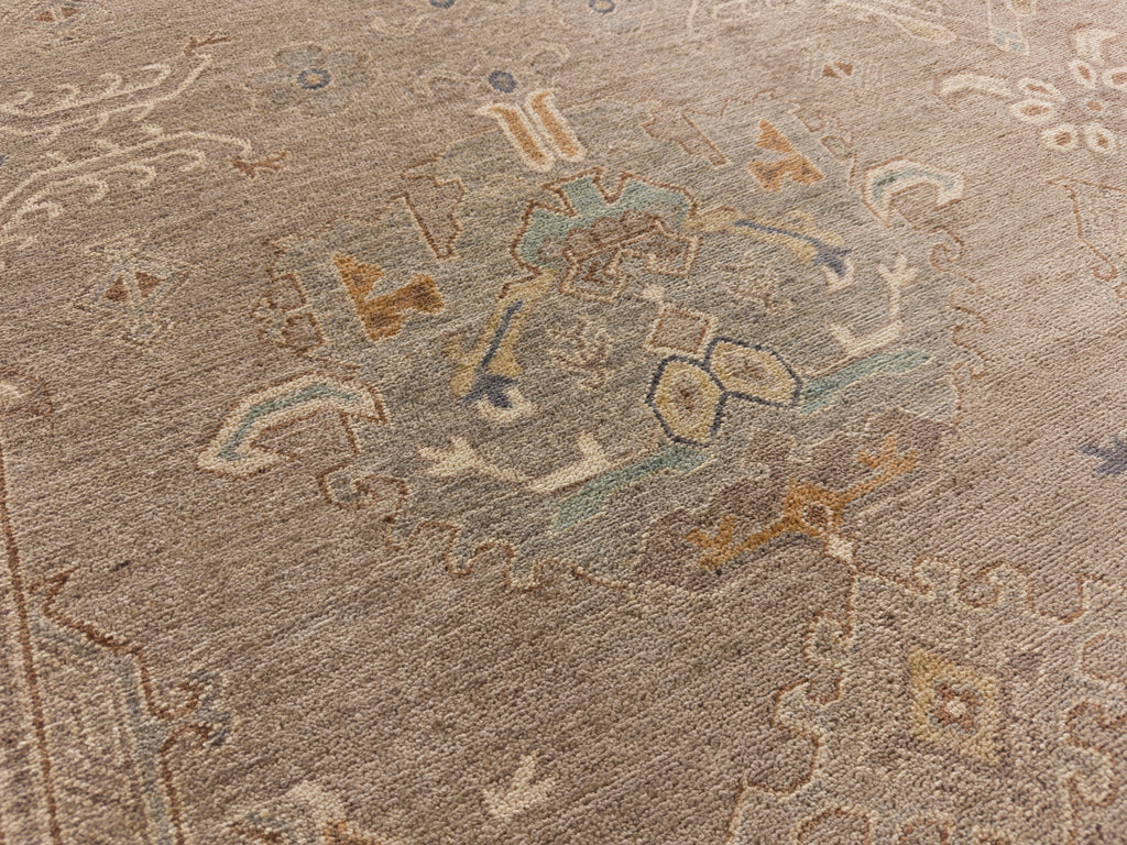8x10 Roya Rugs Pineville North Carolina modern muted oushak wool rug with neutral greige, grey, beige, apricot orange, light aqua blue and brown colors with vintage design carpet.