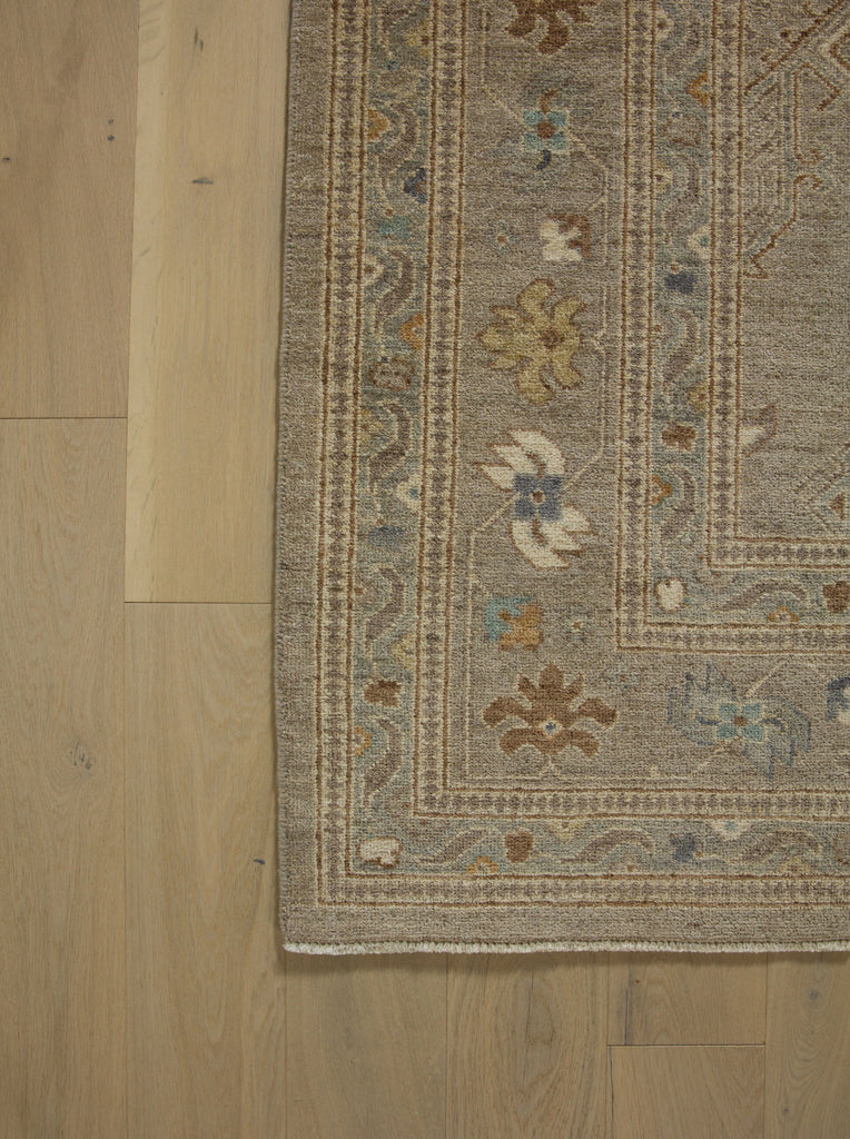 8x10 Roya Rugs Pineville North Carolina modern muted oushak wool rug with neutral greige, grey, beige, apricot orange, light aqua blue and brown colors with vintage design carpet.