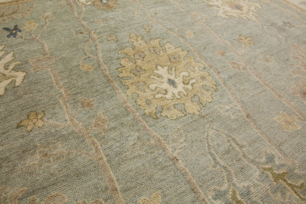 Roya Rugs store nc 8x10 shale grey / ivory modern oushak rug with floral design and sage green, denim blue, light gold and muted floral design with low pile textura