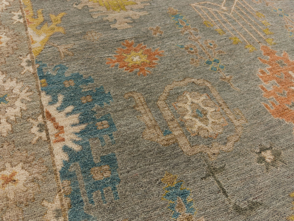 Roya Rugs North Carolina hand knotted one of a kind colorful modern Persian oriental wool rug 9 x 12 with blue grey, citron yellow, citrus, blue, brown, and orange accent colors and floral traditional design with low pile texture and lanolin natural fiber.