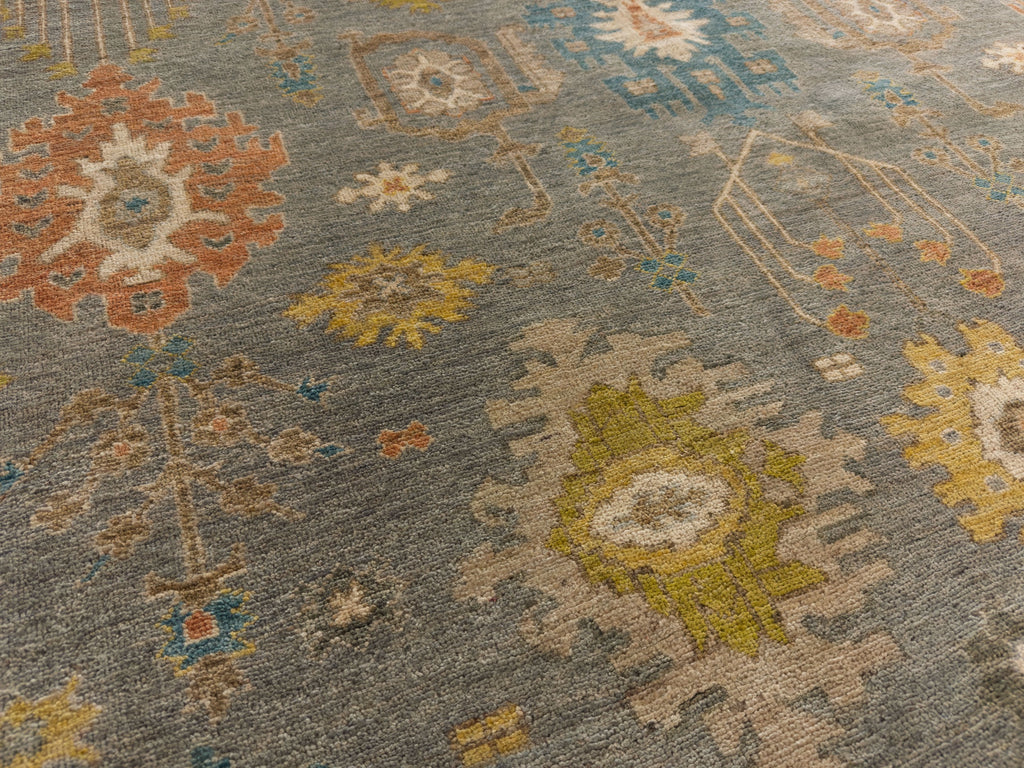 Roya Rugs North Carolina hand knotted one of a kind colorful modern Persian oriental wool rug 9 x 12 with blue grey, citron yellow, citrus, blue, brown, and orange accent colors and floral traditional design with low pile texture and lanolin natural fiber.