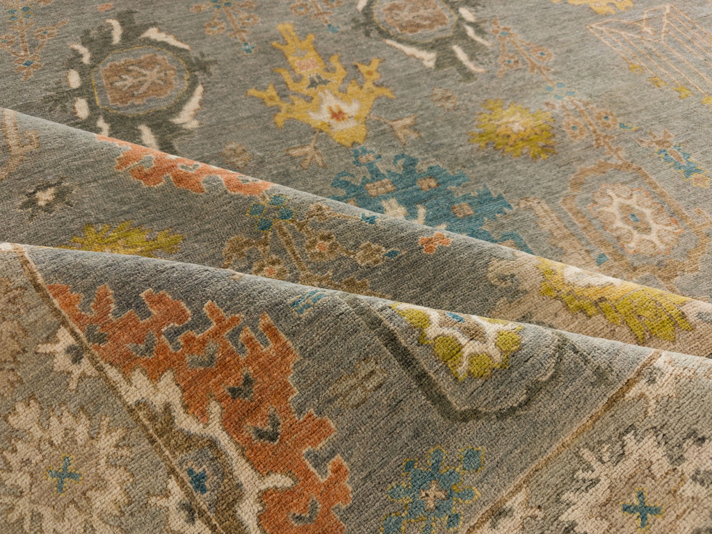 Roya Rugs North Carolina hand knotted one of a kind colorful modern Persian oriental wool rug 9 x 12 with blue grey, citron yellow, citrus, blue, brown, and orange accent colors and floral traditional design with low pile texture and lanolin natural fiber.