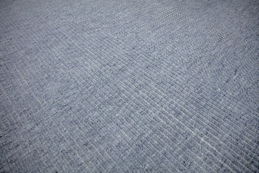 Claire CL-01 Denim Ivory wool rug with textured pile and solid with hidden pattern and variations of blue by Roya Rugs