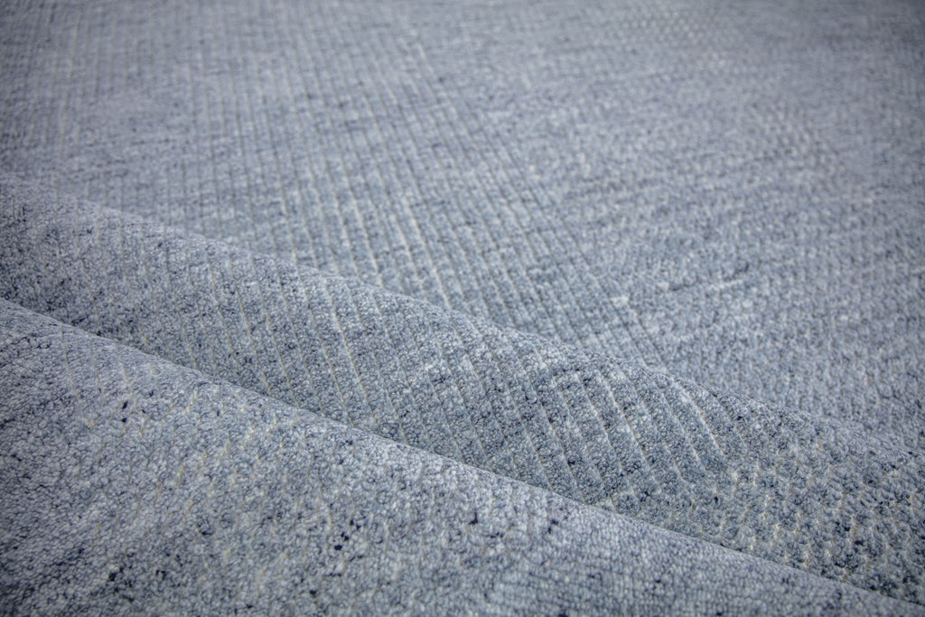 Claire CL-01 Denim Ivory color folded wool rug with textured pile and solid with hidden pattern by Roya Rugs