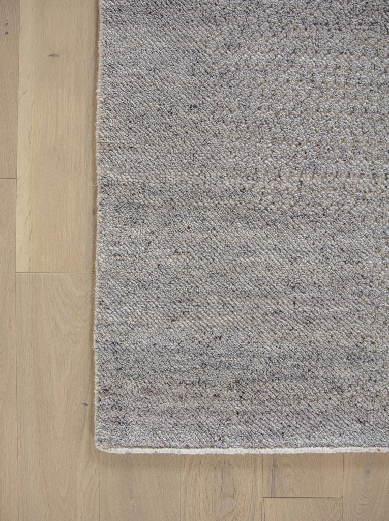 Claire CL-03 Grey Neutral wool rug with solid hidden contemporary design and variations of warm grey, brown, linen, flax and ivory/beige colors with light french hardwood floors by Roya Rugs