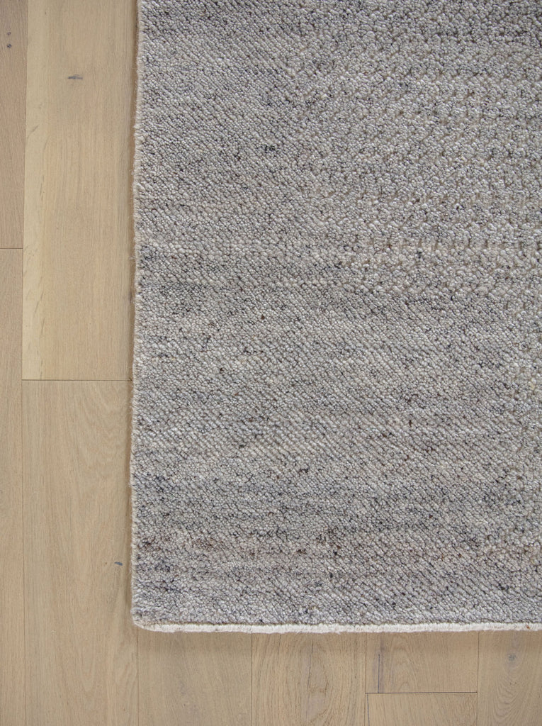 Claire CL-03 Grey Neutral wool rug with solid hidden contemporary design and variations of warm grey, brown, linen, flax and ivory/beige colors with light french hardwood floors by Roya Rugs