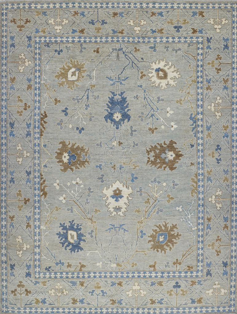 8x10 hand knotted modern oriental Oushak rug made of wool with grey green tint primary colors and accent dark blue, brown and ivory/beige.