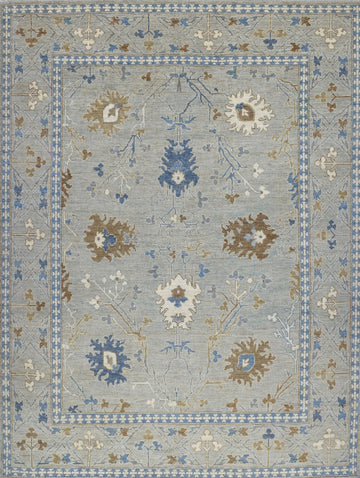 8x10 hand knotted modern oriental Oushak rug made of wool with grey green tint primary colors and accent dark blue, brown and ivory/beige.