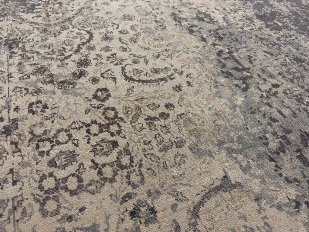 Transitional distressed wool and silk rug with dark grey, beige, indigo blue, and champagne brass colors