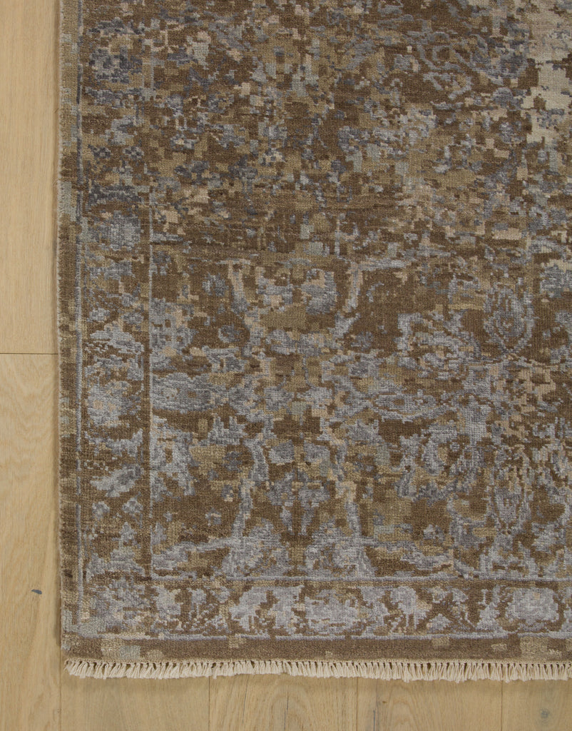 New distressed taupe and silver rug corner with fringe