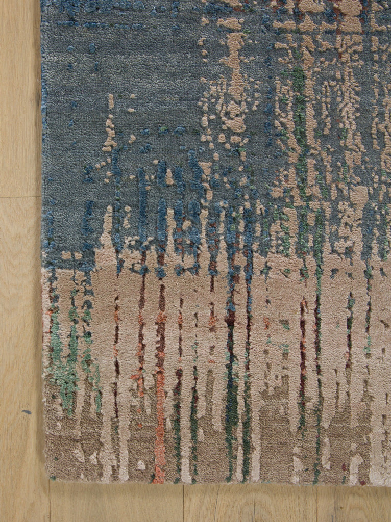 Colorful jade green modern rug with blue, beige and natural sisal color.