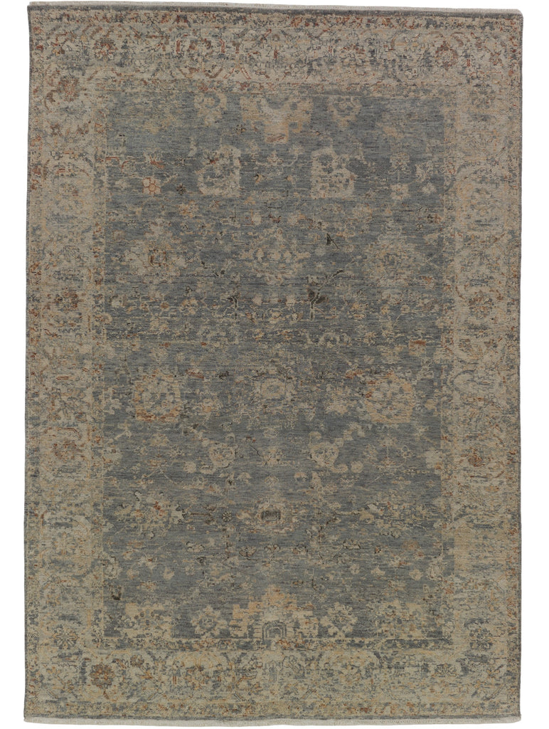 Distressed slate blue, nude beige, and brick red oriental floral wool rug.